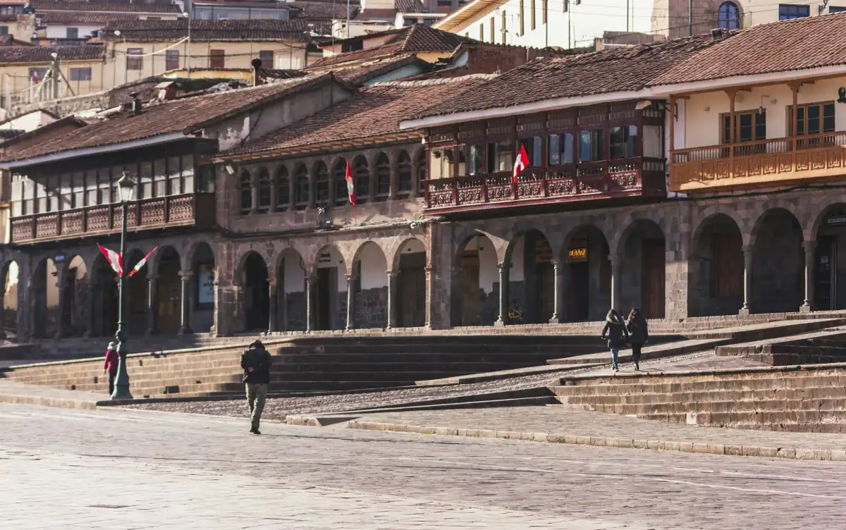 Colonial arcades and wooden balconies on the Plaza de Armas in Cusco.