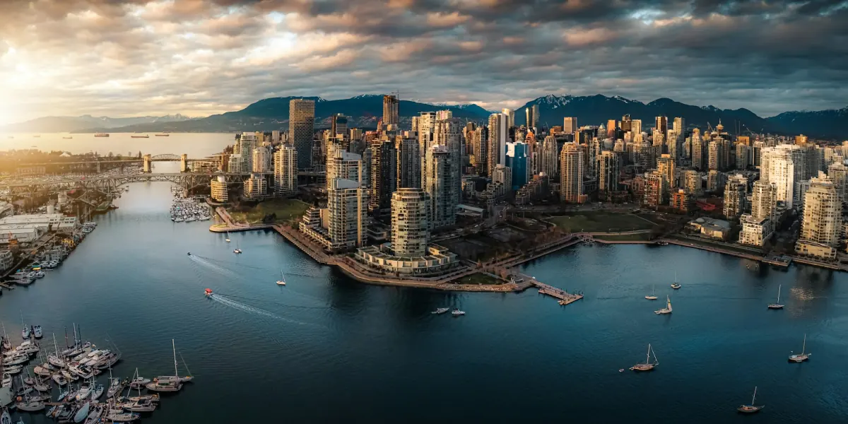 Downtown Vancouver and False Creek from above, with the North Shore mountains behind.